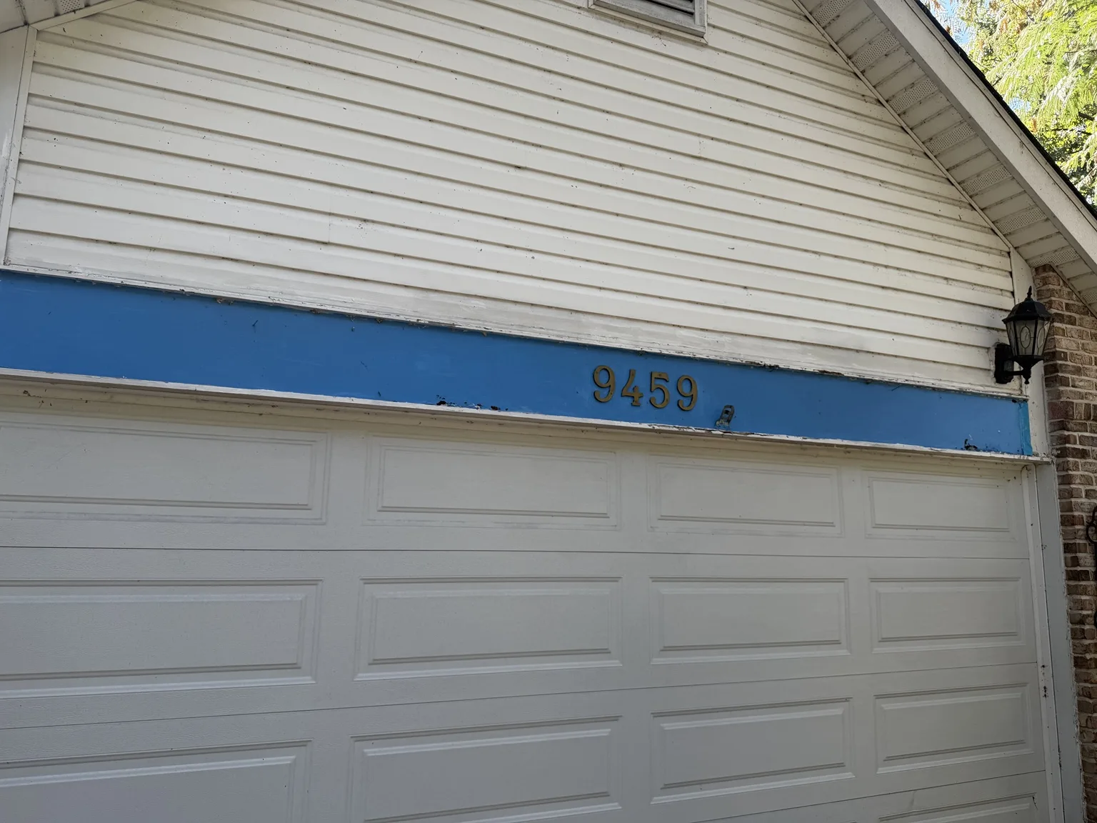 Garage trim before the repair